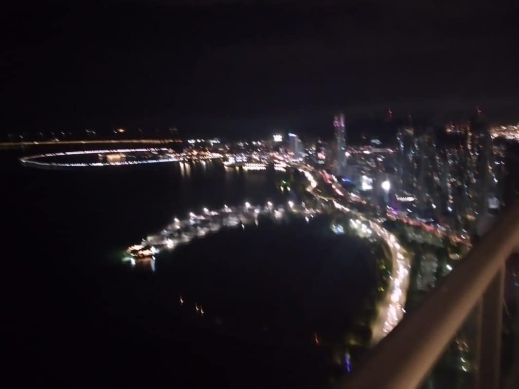 Night panoramic view of Pacific Ocean coastline from balcony at PH Water on the Bay Panama