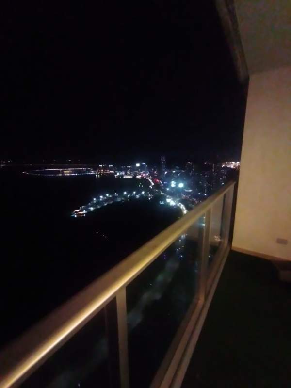 Laundry area with washer dryer sink and window city view PH Water Avenida Balboa Panama