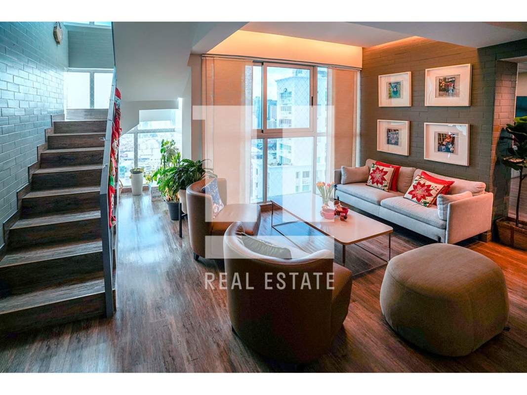 Spacious penthouse kitchen with quartz counters and stainless appliances in El Carmen Panama City