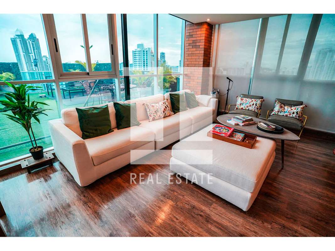 Bright master bedroom of penthouse in PH Trinity Tower, panoramic windows, wood floors Panama City