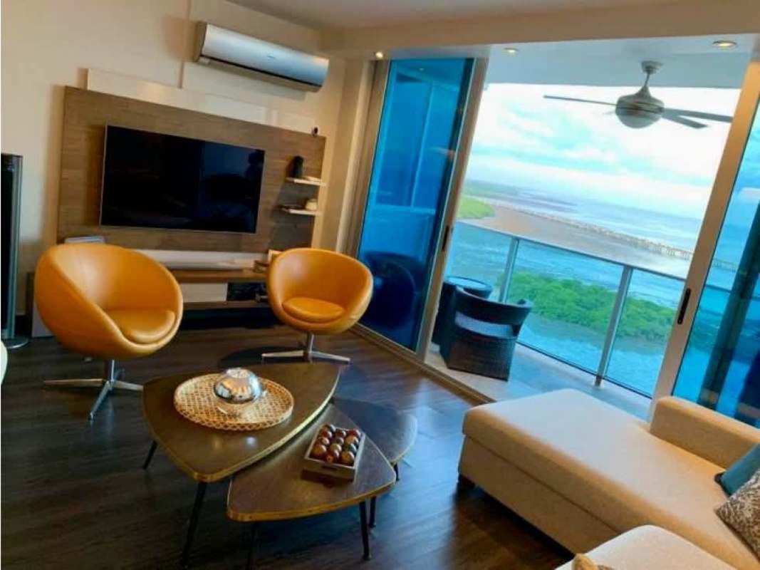 Bright living room with ocean view, large windows and balcony access PH Premium Tower Panama City