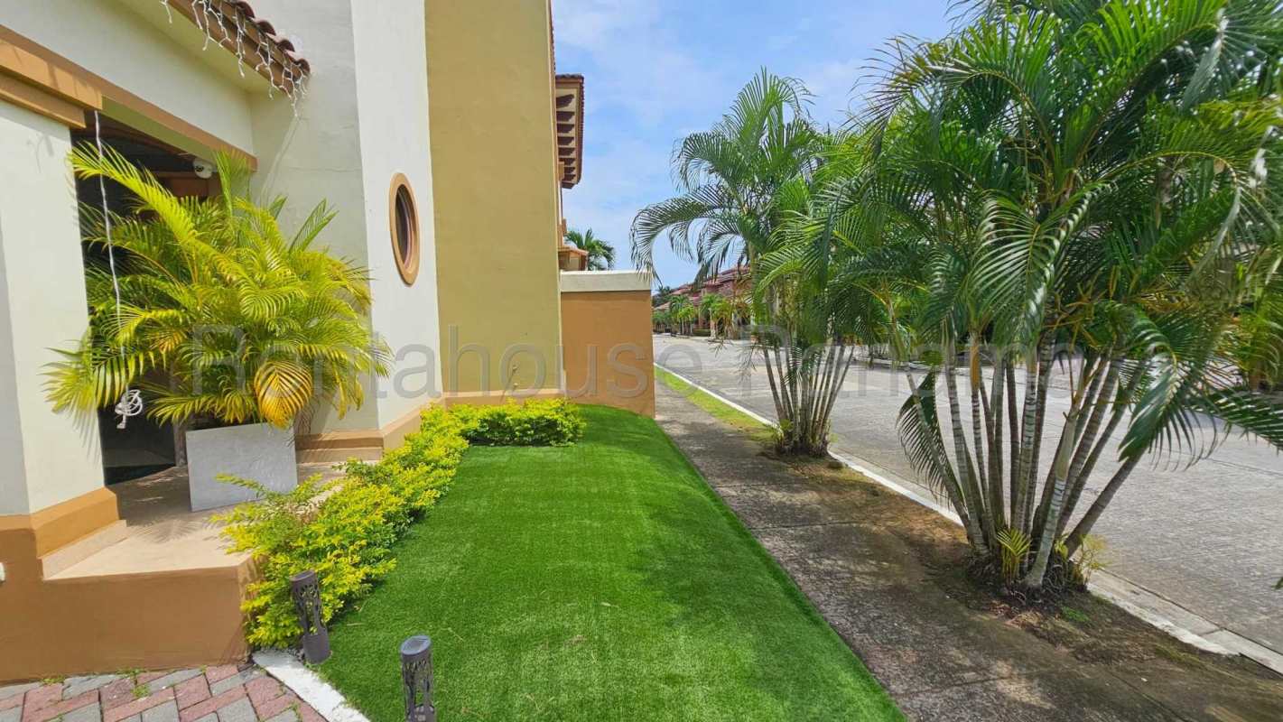 Spacious living area with large windows, tile floors, in Costa Sur house