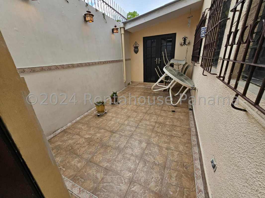 Private enclosed patio with tiled floor, plants, ideal outdoor space Altos del Golf Panama City