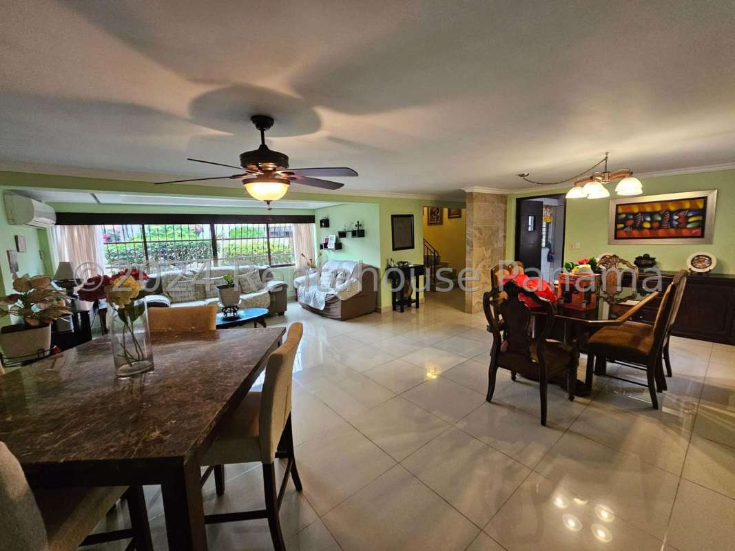 Bedroom with balcony, built-in closet, AC unit, ceramic tiled floor in Altos del Golf house Panama
