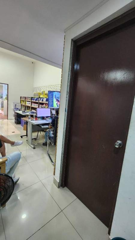 Retail store interior slat wall shelves merchandise at Los Andes Mall San Miguelito Panama