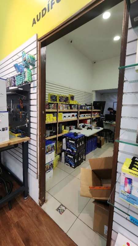 Retail store view lighting fixtures shelving merchandise Los Andes Mall Panama