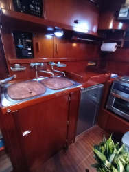 View of Puerto Lindo Marina with multiple boats docked and lush hills in Portobelo Panama Caribbean