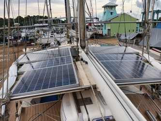 Compact marine galley kitchen with stainless appliances on Amel Maramu sailboat, Panama