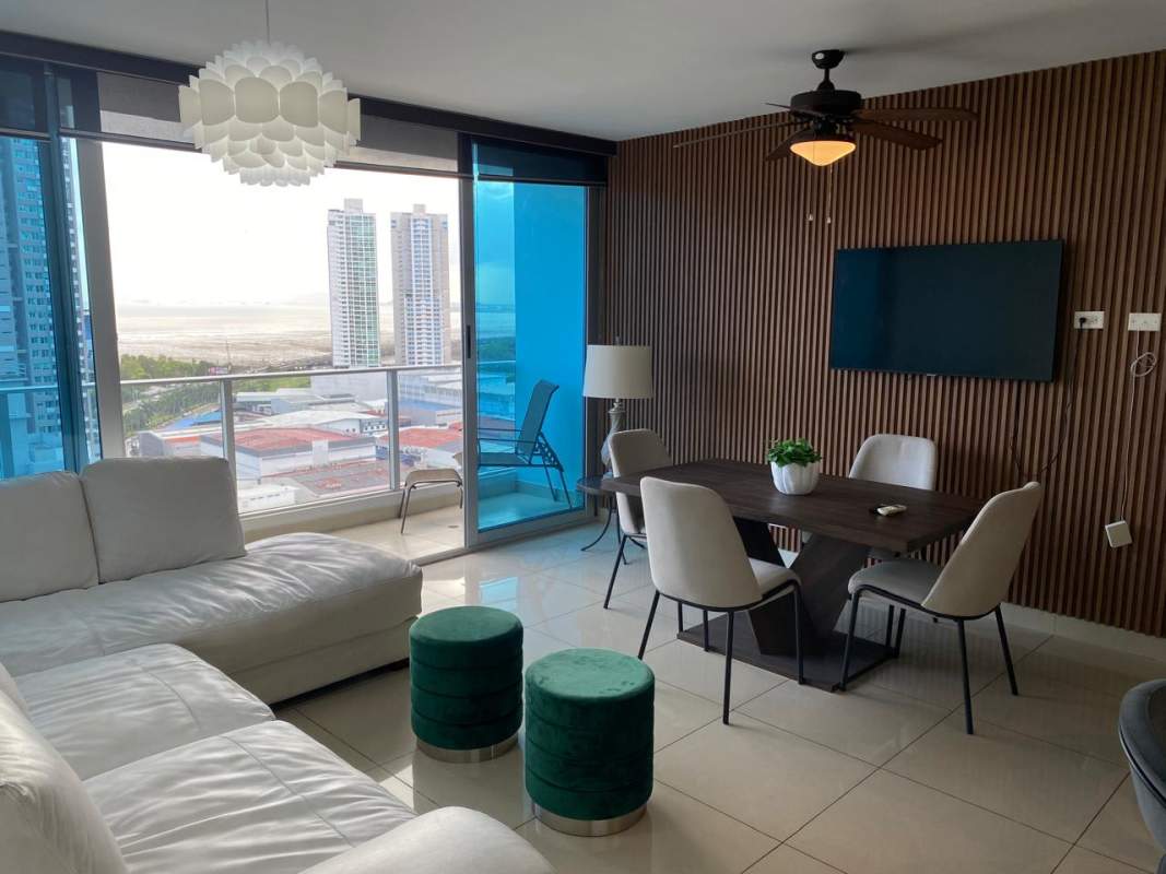 Master bedroom with large windows offering sea and skyline views PH Top Towers