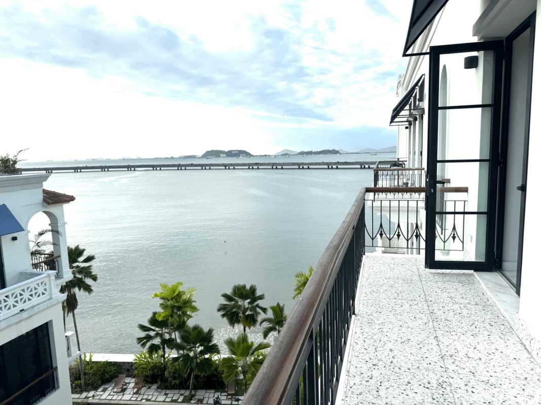 Balcony with wrought iron railing overlooking the Pacific Ocean and historic Casco Viejo streets
