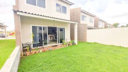 Private fenced backyard with patio and grass in Costa Verde La Chorrera house