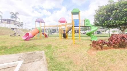 Outdoor playground with colorful equipment and landscaping Costa Verde