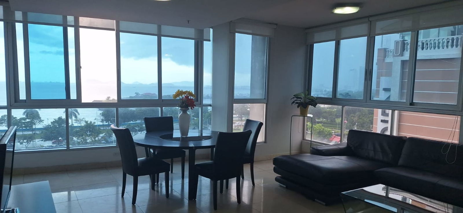 Dining room with panoramic windows overlooking Pacific Ocean and Panama skyline PH Vista del Mar