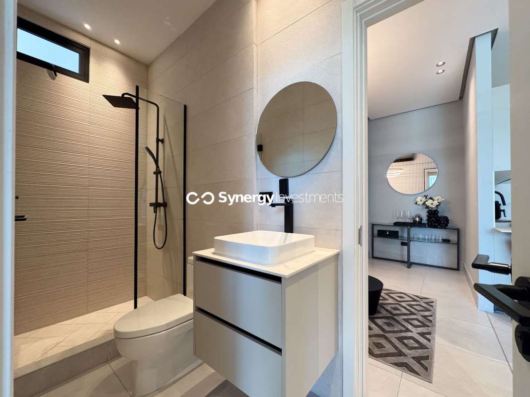 Modern bathroom Kohler fixtures glass shower in PH Paitilla Tower luxury apartment for sale Panama