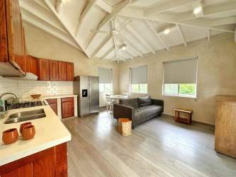 Open kitchen living with beams large windows and natural light El Ciruelo Playa Venao Panama