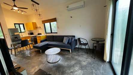 Bright dining space with modern ceiling fans natural lighting in Playa Venao Panama duplex rental