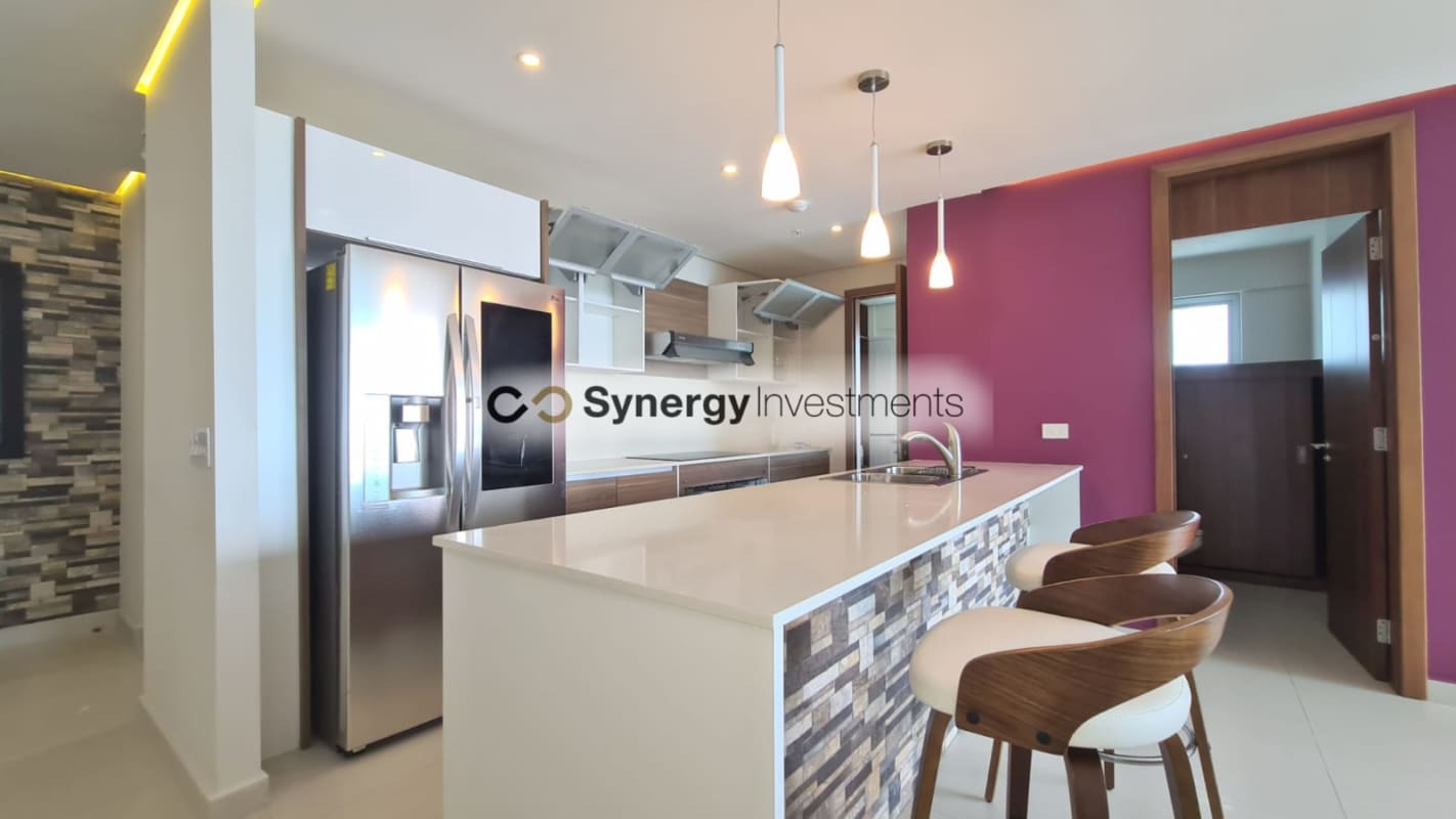Modern bathroom with marble countertop double sinks walk-in shower at PH Costa del Este Panama