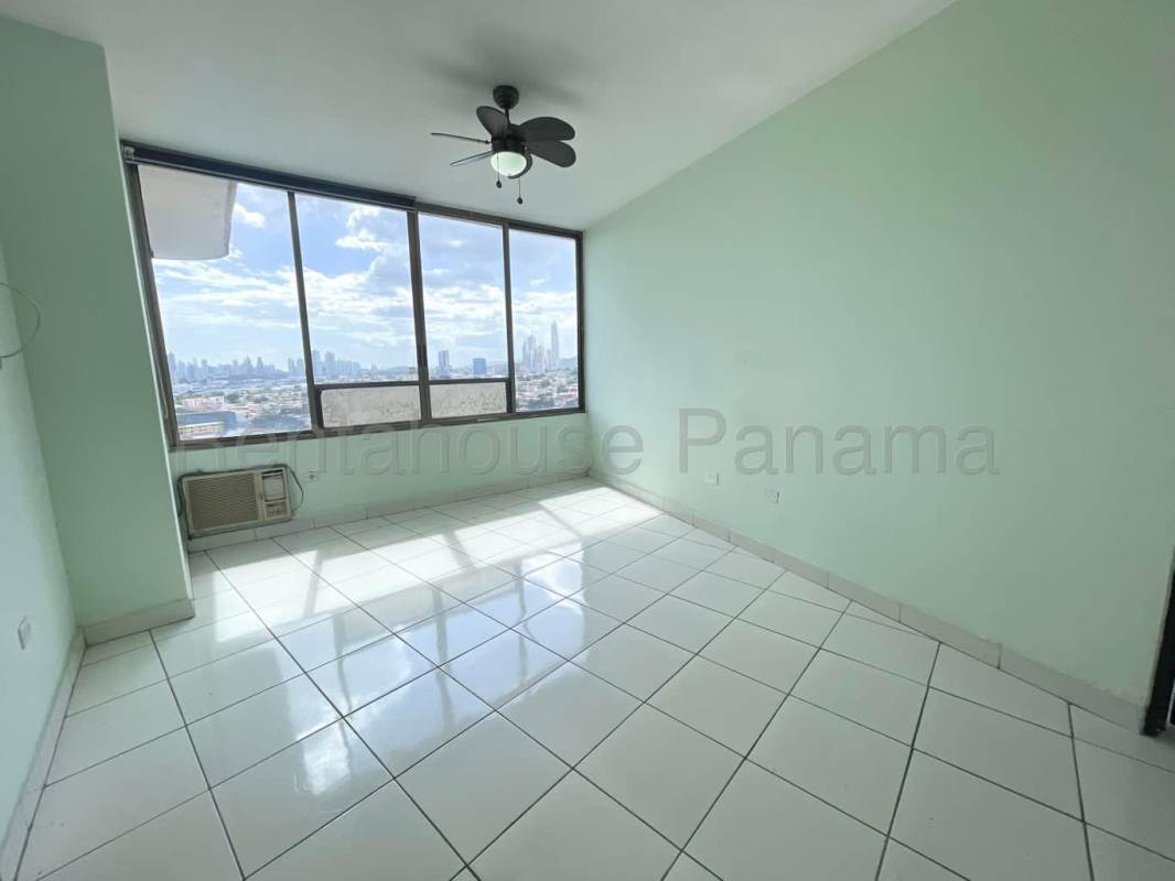 Bright living room tiled floors, large windows with skyline views Betania Panama