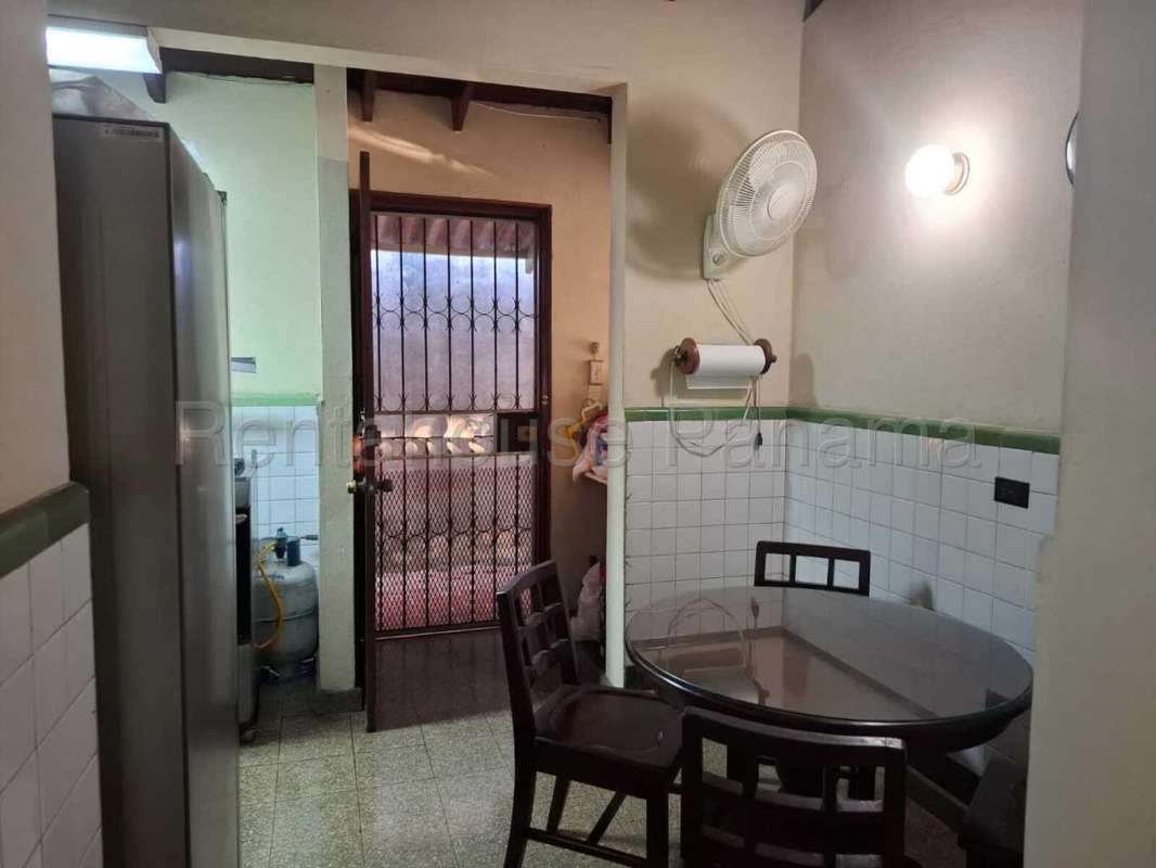 Traditional kitchen and small dining area with tiled walls and gas stove Miraflores Betania Panama