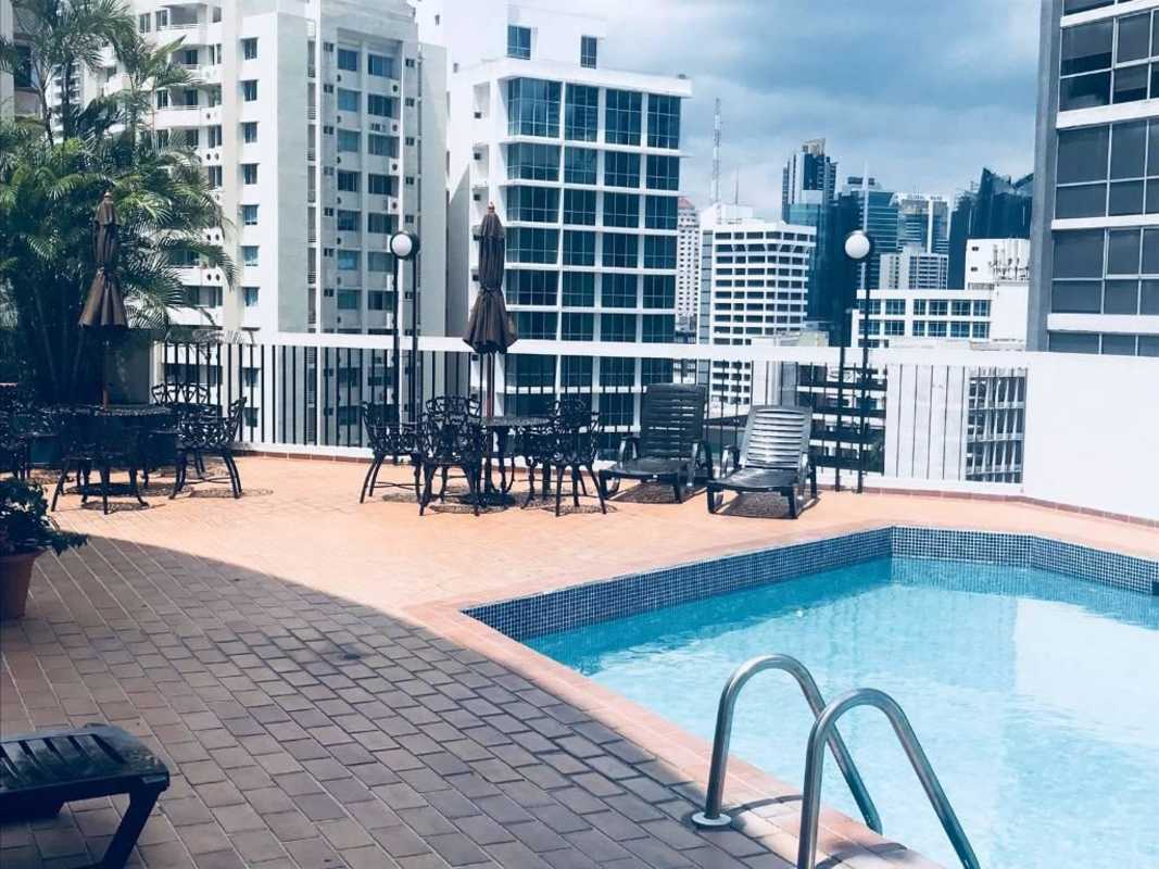 Rooftop pool deck with city skyline in PH EL Cangrejo Tower Panama City