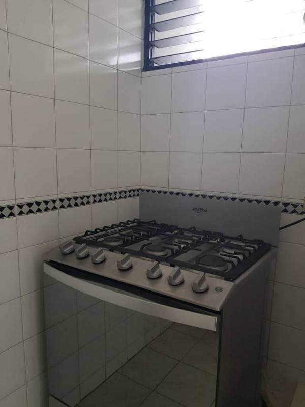 Kitchen corner with gas stove, oven, tiled wall PH EL Cangrejo Tower El Cangrejo Panama