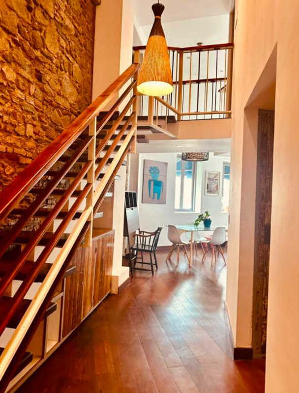 Contemporary bathroom with vessel sink, wood countertop, framed mirror in Casco Viejo Panama apartment