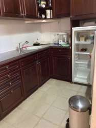 Spacious living area with large windows and tropical garden view in Coronado Bouganvillas Villa