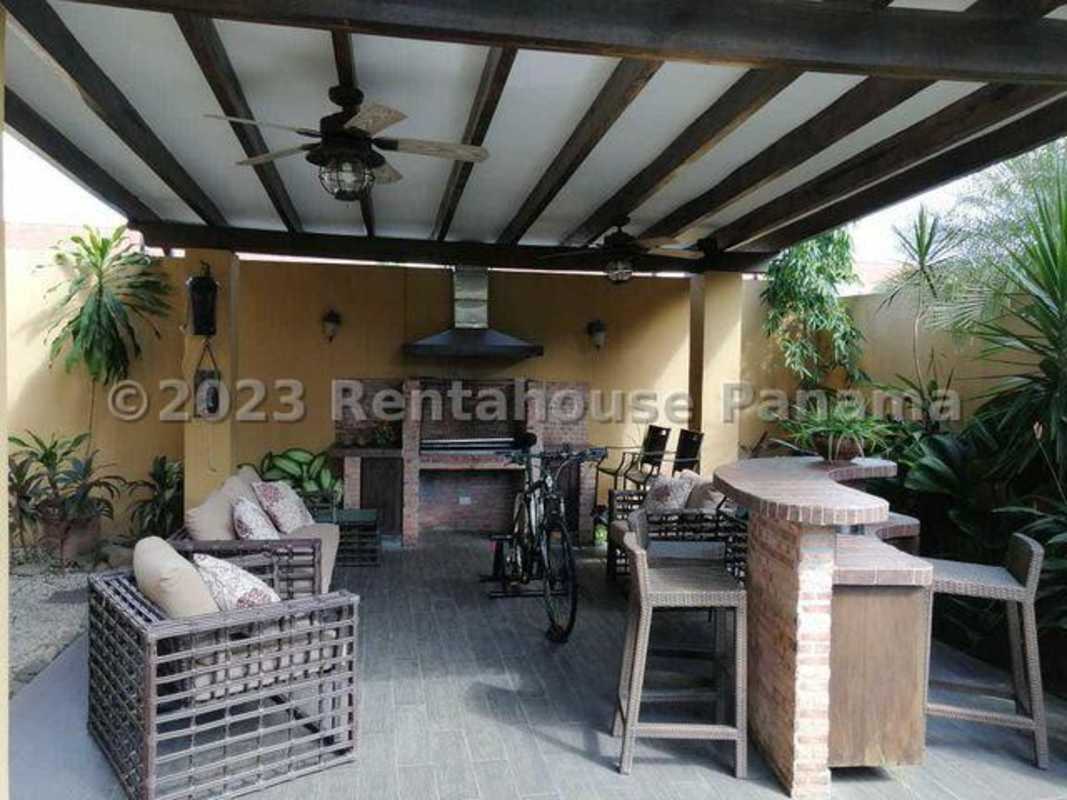 Covered rustic terrace with ceiling fans, outdoor bar, grill, dining in Costa del Este luxury house