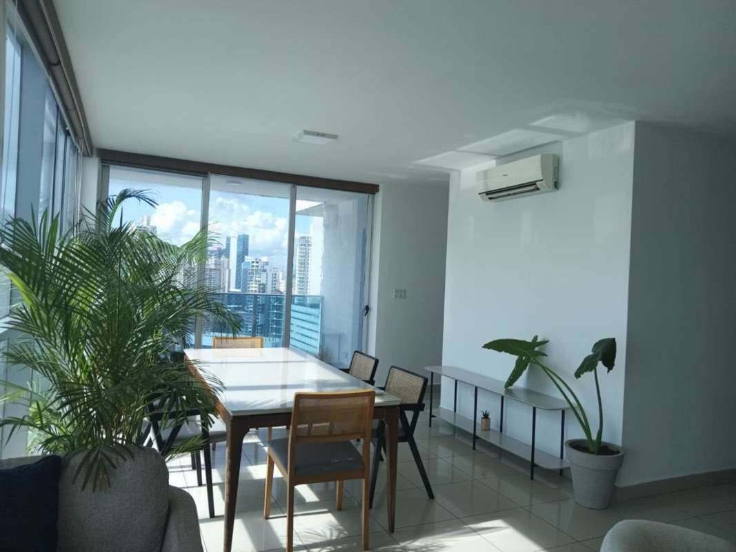 Bright living room with large windows and city skyline views PH Waterfalls Panama