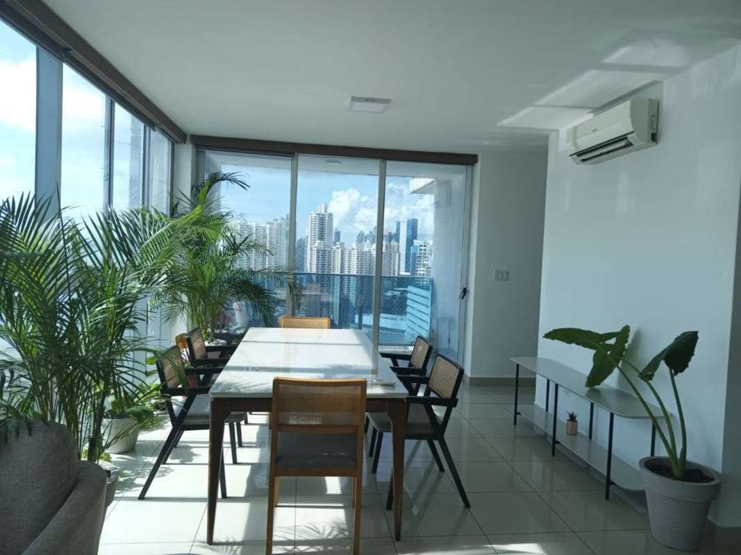 Master bedroom featuring large windows with ocean view PH Waterfalls Coco del Mar Panama City