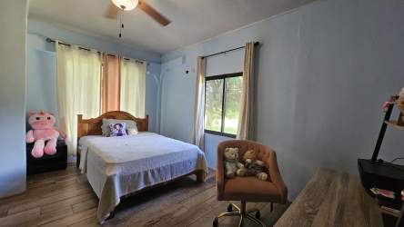 Spacious open plan kitchen with island and dining space in mountain house Panama