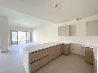 Bright modern living and dining space with floor-to-ceiling glass and ocean view Playa Escondida Panama