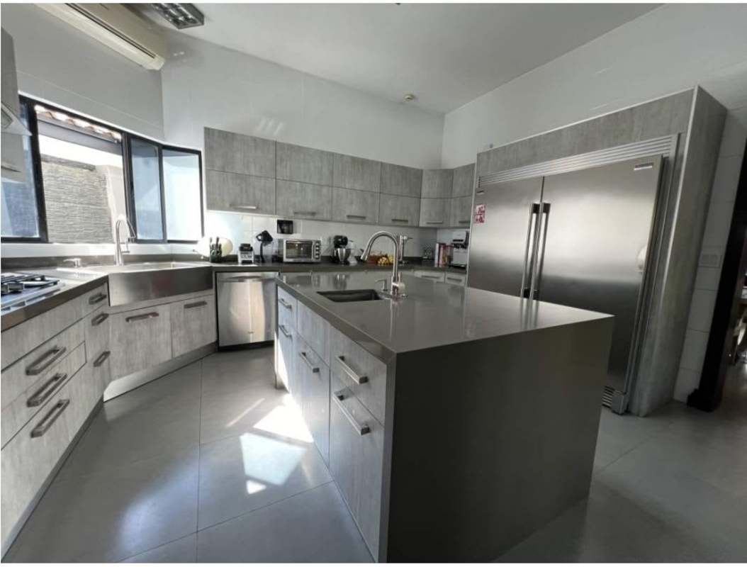 Spacious kitchen with island stainless appliances marble counters Costa del Este Panama
