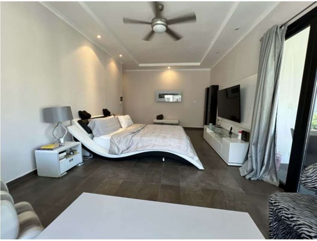 Spacious bedroom with balcony glass doors and AC Costa del Este Panama