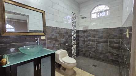 Bright spacious foyer with staircase to second floor inside estate house in Volcán Tierras Altas Panama