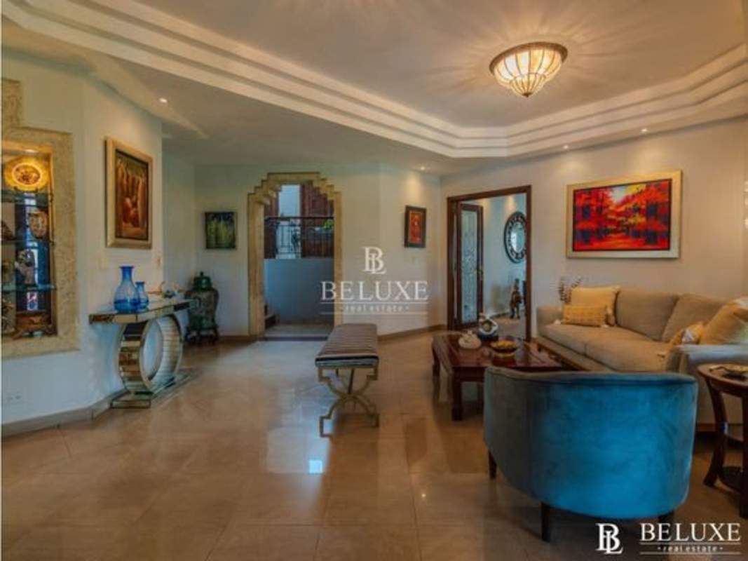 Spacious outdoor covered terrace overlooking gardens and pool in Panama luxury villa