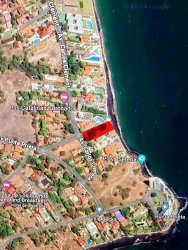 Aerial view lush beachfront neighborhood with homes and vegetation Coronado Panama