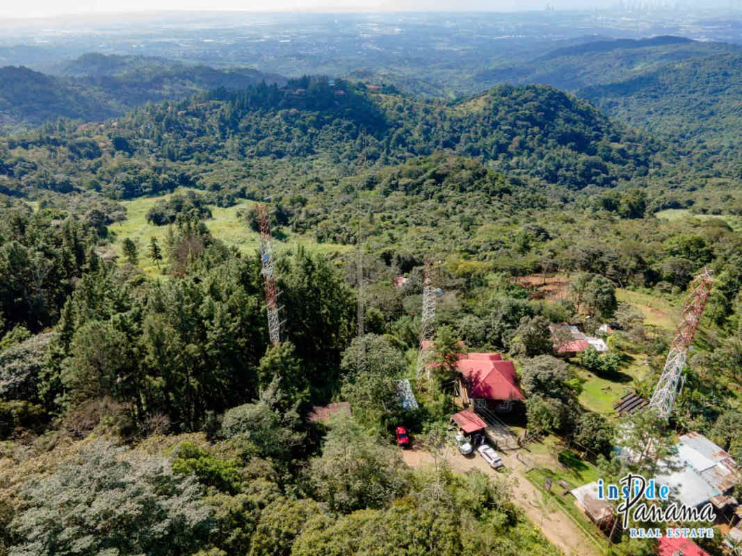 Panoramic aerial view of dense forest mountain land with communication infrastructure Cerro Azul Panama