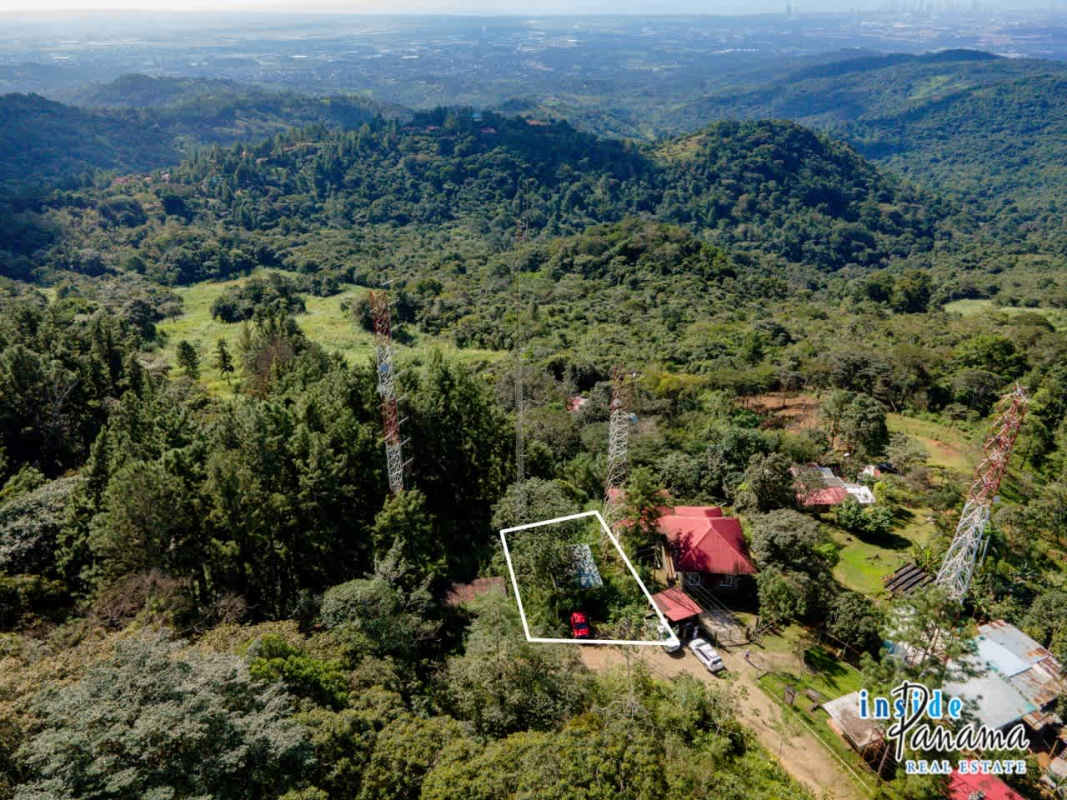 Mountain forest landscape and clearings with communication towers on rural land for sale Panama