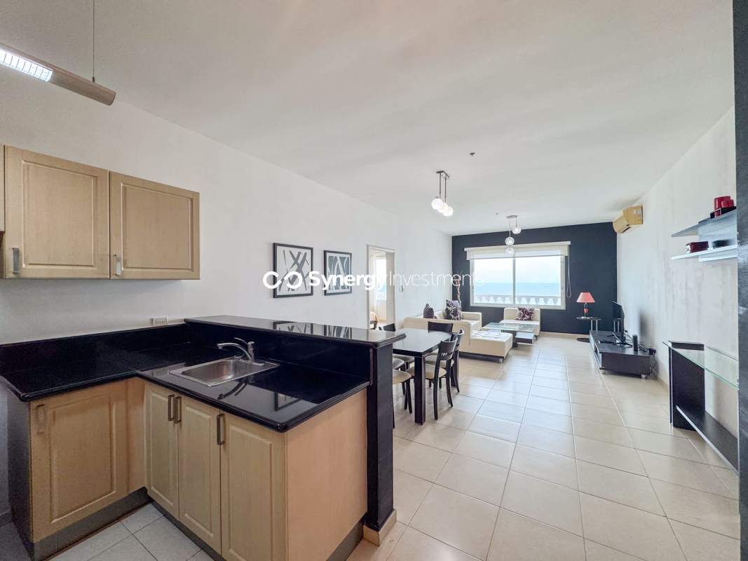 Modern open kitchen with granite countertop and peninsula in oceanfront apartment Panama