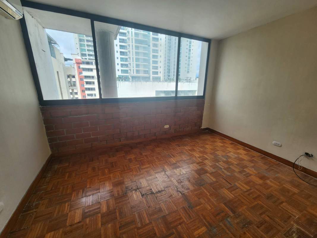 Bedroom with large window, parquet floor, built in wardrobes and city views PH La Caleta Panama