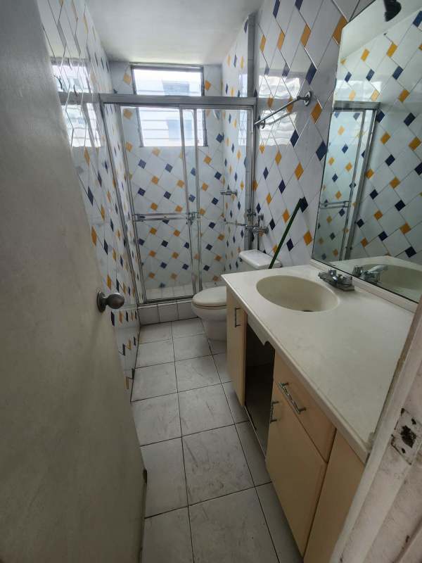 Bathroom featuring colored diamond tiles, large mirror, enclosed shower PH La Caleta Penthouse Panama