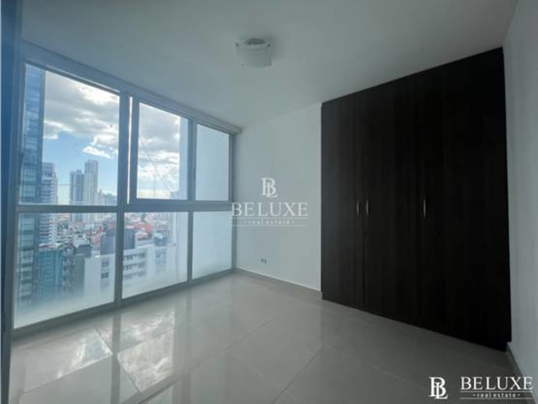 Modern bathroom with glass shower, sink, and mirror in Belle View Tower Panama City