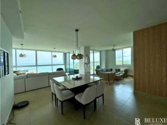Spacious modern beachfront apartment with large windows ocean view living dining combined