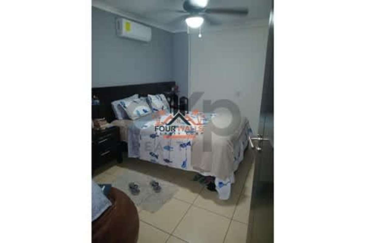 Comfortable bedroom with ceiling fan and air conditioning at PH Constellation Dos Mares