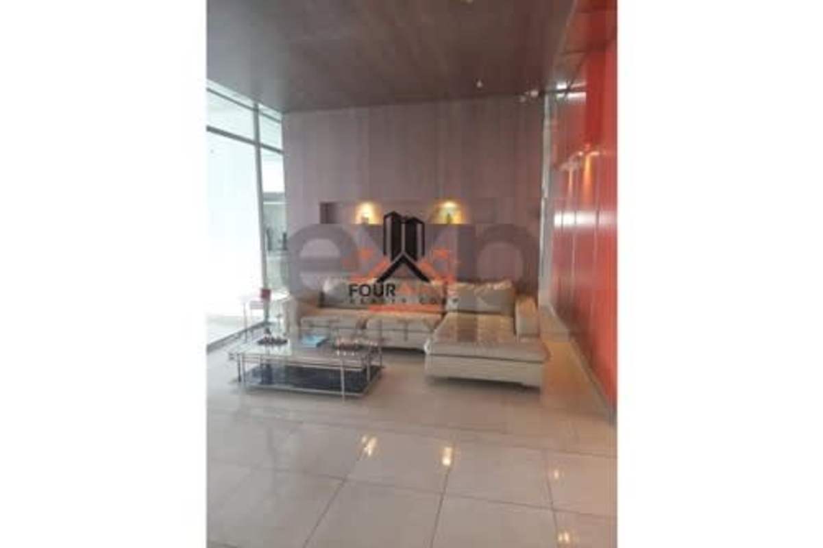 Condo gym with modern equipment and city view windows at PH Constellation Dos Mares Panama