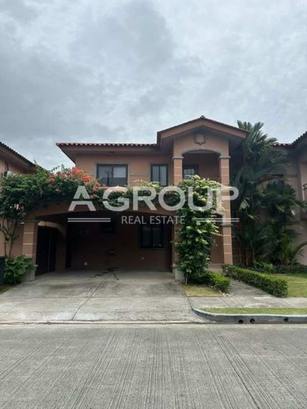 Guest bathroom with mosaic backsplash, white vanity, and wood-style floor in Versalles Costa Sur Panama