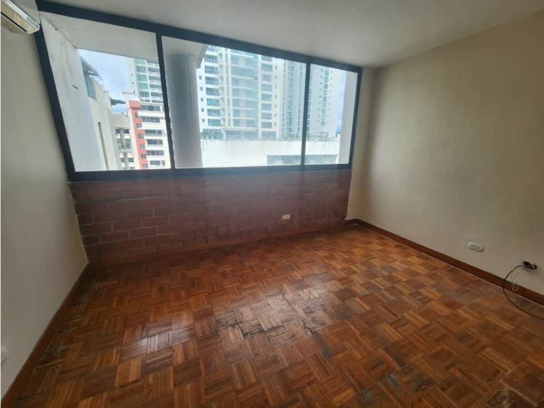 Penthouse bedroom with brick accent wall, big windows towards skyline and ocean PH Waterfront Coco del Mar