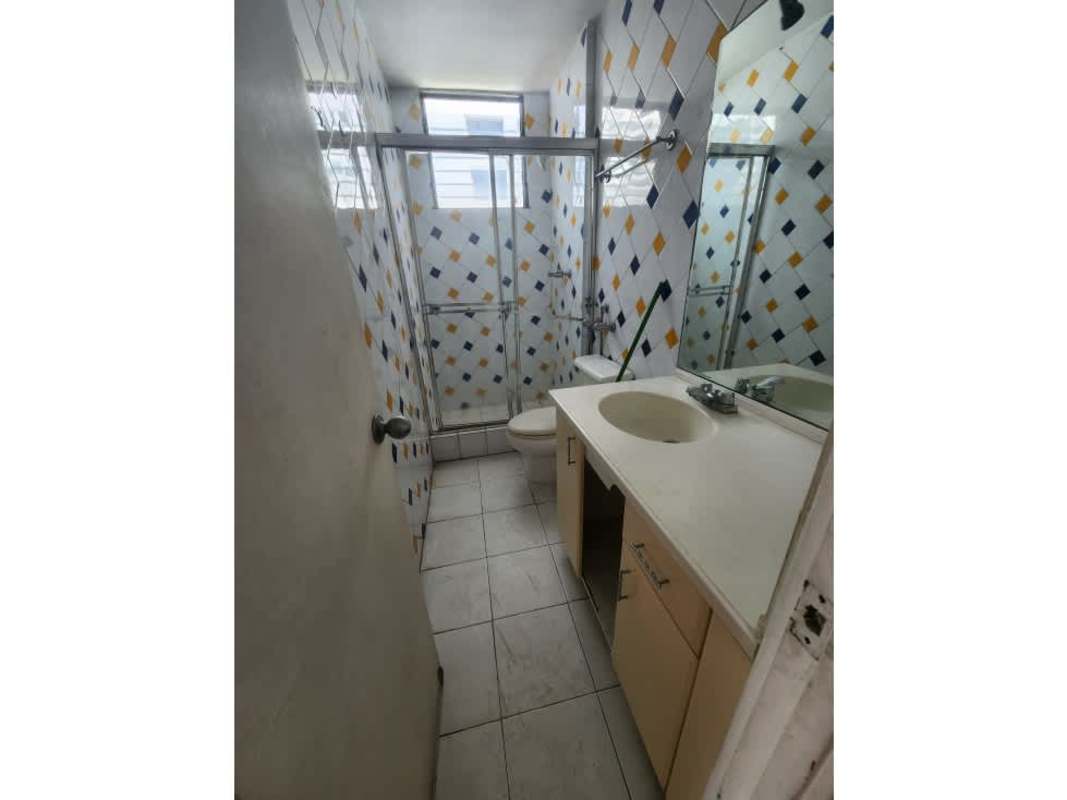 Minimalist bathroom with tiled walls, modern glass shower, vanity PH Waterfront Coco del Mar Panama