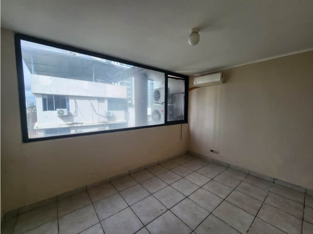 Bedroom with large window, AC unit, ceramic tile flooring in PH Waterfront Coco del Mar Panama City